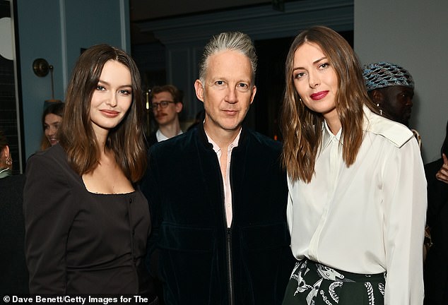 Maria put on a leggy display in a dark green miniskirt with a chainlink design with a chic white collared shirt (pictured with Kristina  and Jefferson Hack)