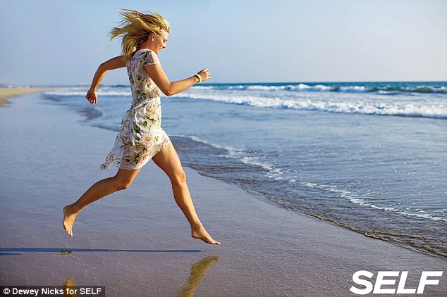 Shapely: Maria shows off her athletic legs as she sprints towards the ocean