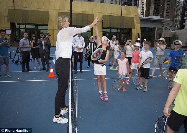 How high can you go? Maria was also seen using her height to have advantage as she teased the children when they jumped with all their might to try and high-five her