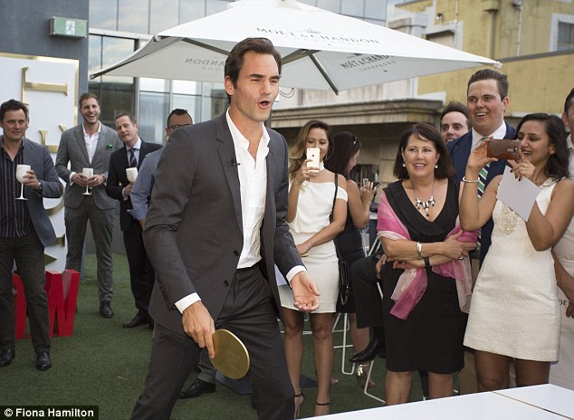 Watch him go: The world number three also showed off his skills during a quick game of table tennis