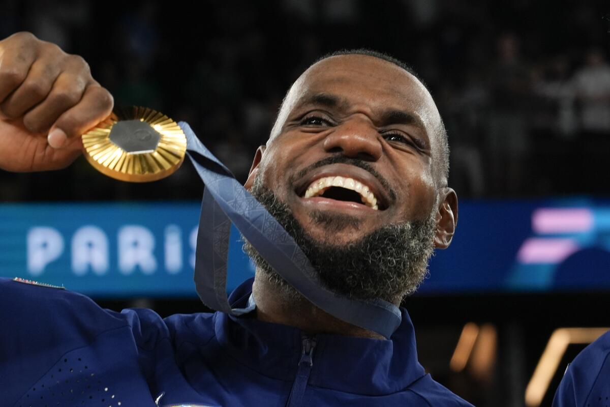 LeBron James celebrates his gold medal at the Paris Olympics.