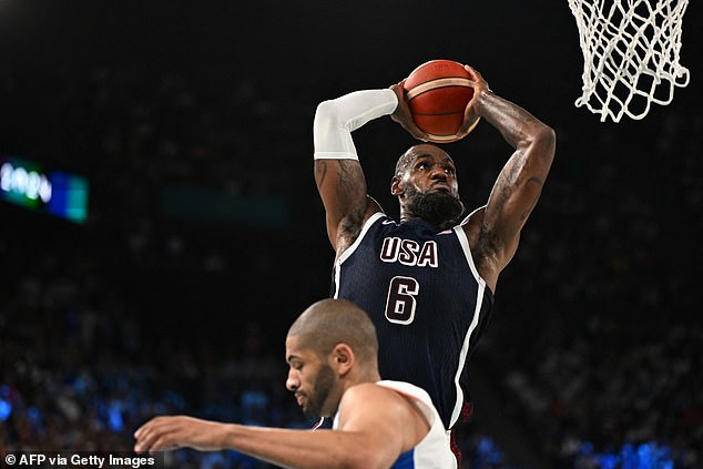 NBA forward Nic Batum was wise to get out of the way as James coasted for an easy slam