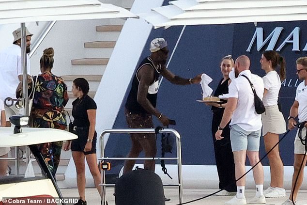 The power forward soaked up the sunshine onboard the luxurious yacht off the Amalfi Coast