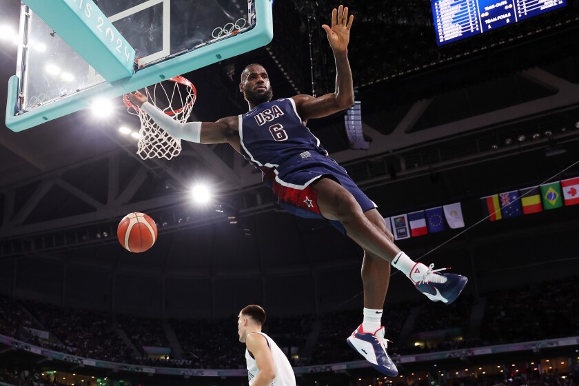 Team USA's Lebron James dunks the ball against Team Serbia