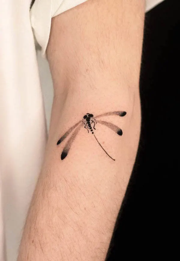 Simple gradiant dragonfly tattoo by @dahan.orient