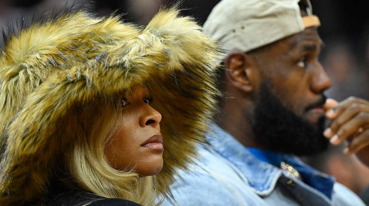 Lakers forward LeBron James and his wife Savannah James watch the game in the second quarter of game four of the second round for the 2024 NBA playoffs between the Cleveland Cavaliers and the Boston Celtics at Rocket Mortgage FieldHouse.