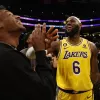 LeBron James #6 of the Los Angeles Lakers reacts with Bronny James after scoring to pass Kareem Abdul-Jabbar to become the NBA’s all-time leading scorer. Harry How/Getty Images